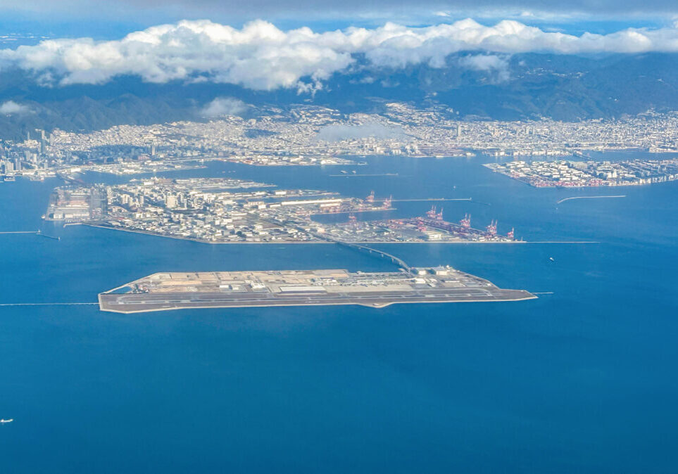 Aerial view of the Kansai International Airport (KIX) with izumisano city in background.